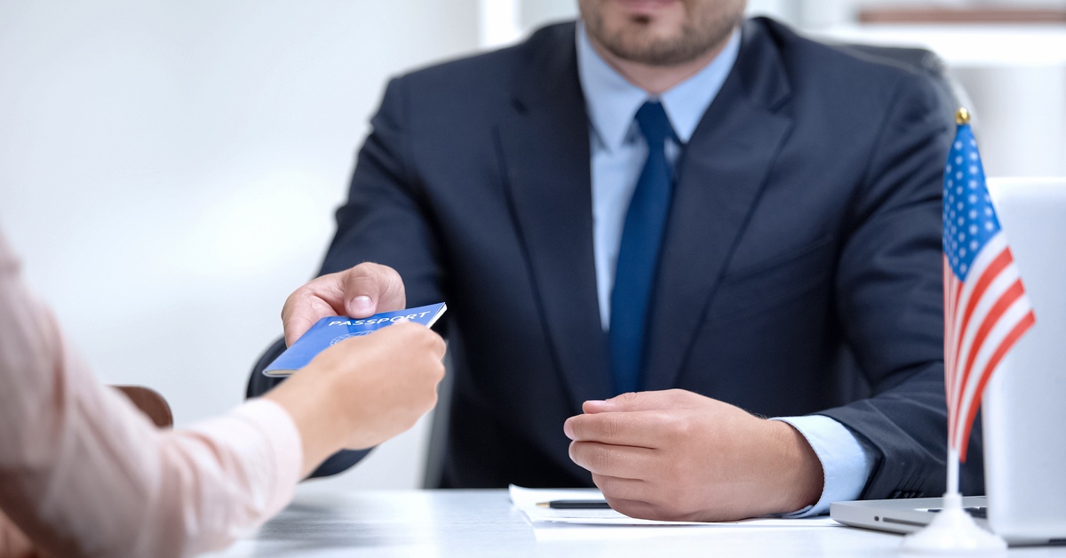 GahaganLawFirm PersonHandingPassport